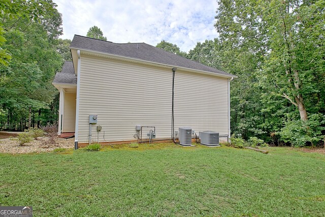 4135 Coursey Lake Rd, Douglasville, GA 30135 - view of side of home featuring a lawn