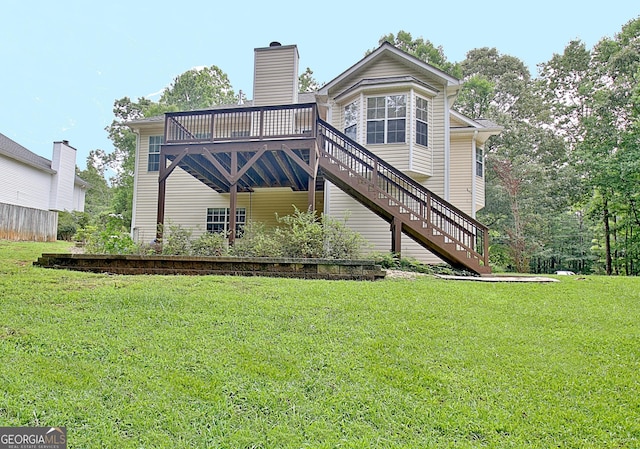 4135 Coursey Lake Rd, Douglasville, GA 30135 - back of property with stairway, a deck, a lawn, and a chimney