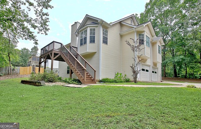 4135 Coursey Lake Rd, Douglasville, GA 30135 - view of home's exterior featuring stairway, a deck, a garage, a chimney, and concrete driveway