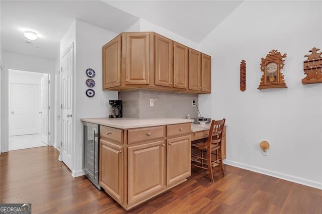 1402 Silver Smt, Conyers, GA 30094 - kitchen with wine cooler, dark wood-style floors, decorative backsplash, and light countertops