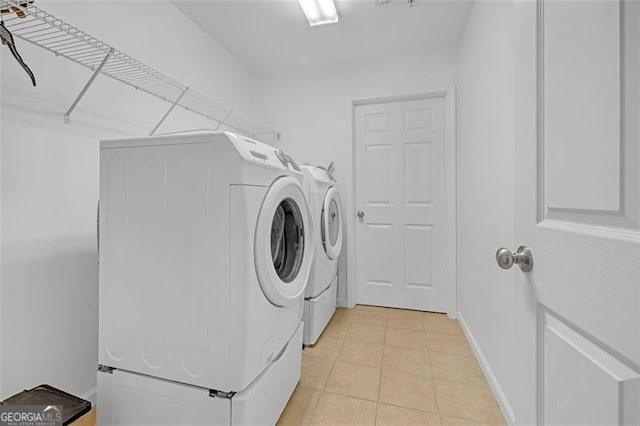 1402 Silver Smt, Conyers, GA 30094 - laundry area with washer and dryer and light tile patterned floors