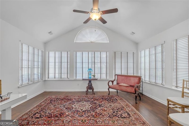 1402 Silver Smt, Conyers, GA 30094 - sitting room with healthy amount of natural light, ceiling fan, wood finished floors, and vaulted ceiling