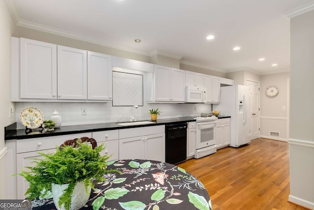 1508 Brianwood Rd Unit 1508, Decatur, GA 30033 - kitchen with white appliances, recessed lighting, dark countertops, backsplash, and light wood-type flooring