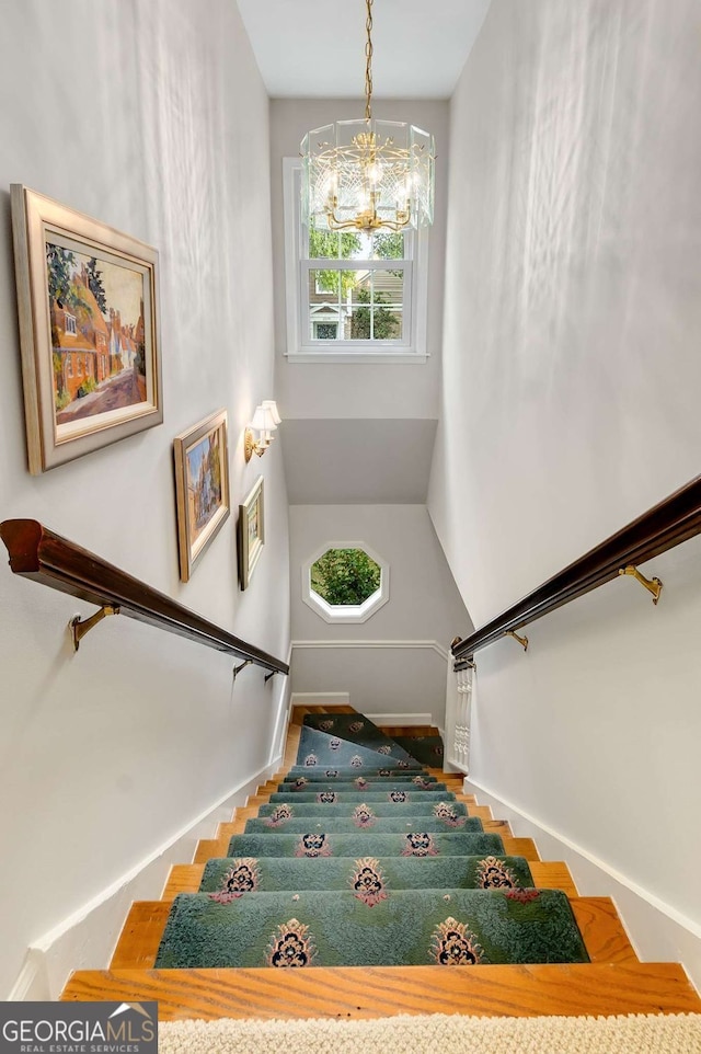1508 Brianwood Rd Unit 1508, Decatur, GA 30033 - stairs featuring a chandelier and baseboards