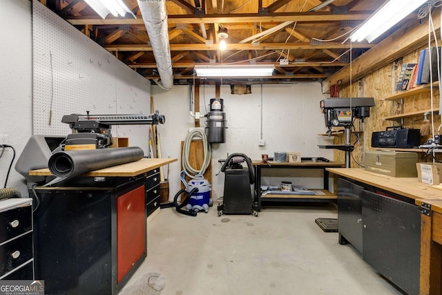 1508 Brianwood Rd Unit 1508, Decatur, GA 30033 - unfinished basement with a workshop area and a central vacuum unit