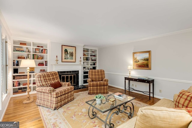 1508 Brianwood Rd Unit 1508, Decatur, GA 30033 - living area featuring wood finished floors, crown molding, a fireplace, and built in shelves