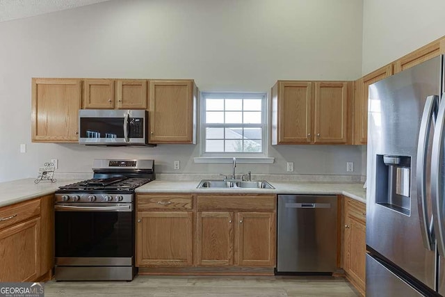 4735 Widgeon Way, Cumming, GA 30028 - kitchen featuring appliances with stainless steel finishes, light wood finished floors, light countertops, and high vaulted ceiling