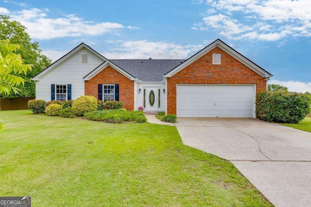 4735 Widgeon Way, Cumming, GA 30028 - view of front of property with brick siding, concrete driveway, a front yard, and an attached garage