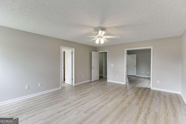 4735 Widgeon Way, Cumming, GA 30028 - empty room featuring a textured ceiling, a ceiling fan, and light wood-type flooring