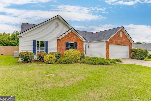 4735 Widgeon Way, Cumming, GA 30028 - view of front facade featuring brick siding, an attached garage, driveway, and roof with shingles