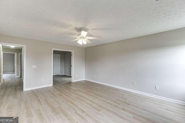 4735 Widgeon Way, Cumming, GA 30028 - empty room featuring a ceiling fan, a textured ceiling, and light wood-style flooring