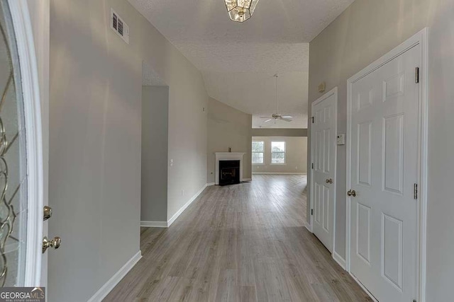 4735 Widgeon Way, Cumming, GA 30028 - hallway featuring vaulted ceiling, light wood finished floors, and a textured ceiling