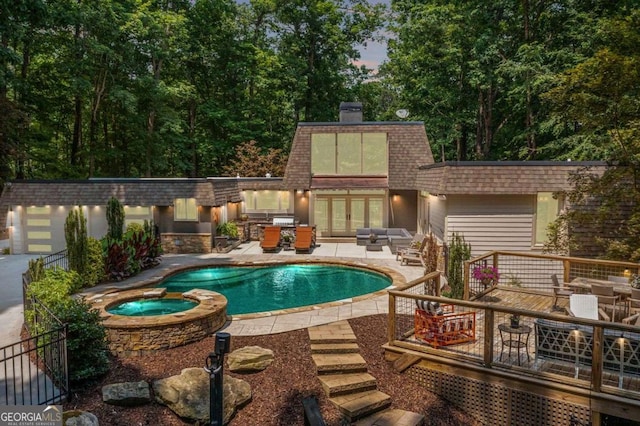 4850 Lake Fjord Pass, Marietta, GA 30068 - view of swimming pool with french doors, a wooden deck, a patio area, a pool with connected hot tub, and outdoor dining space