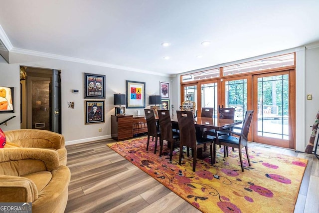 4850 Lake Fjord Pass, Marietta, GA 30068 - dining room featuring french doors, light wood-style floors, crown molding, and recessed lighting