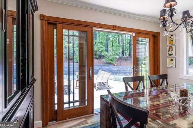 4850 Lake Fjord Pass, Marietta, GA 30068 - dining space with a chandelier, healthy amount of natural light, ornamental molding, and a water view