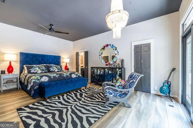 4850 Lake Fjord Pass, Marietta, GA 30068 - bedroom featuring wood finished floors, a chandelier, and ceiling fan