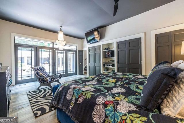 4850 Lake Fjord Pass, Marietta, GA 30068 - bedroom with access to outside, light wood-style floors, a chandelier, and french doors