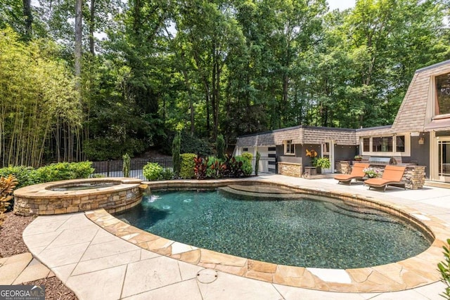 4850 Lake Fjord Pass, Marietta, GA 30068 - view of pool with a patio area, a pool with connected hot tub, and an outbuilding