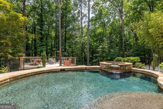 4850 Lake Fjord Pass, Marietta, GA 30068 - view of swimming pool featuring a pool with connected hot tub and a patio area