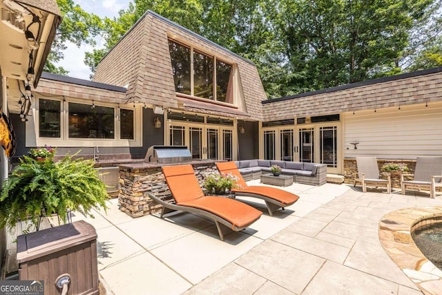 4850 Lake Fjord Pass, Marietta, GA 30068 - back of property with an outdoor kitchen, a shingled roof, a patio area, outdoor lounge area, and mansard roof