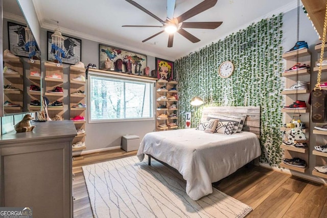 4850 Lake Fjord Pass, Marietta, GA 30068 - bedroom with ornamental molding, wood finished floors, a ceiling fan, and wallpapered walls