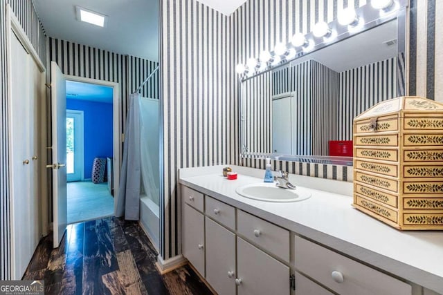4850 Lake Fjord Pass, Marietta, GA 30068 - bathroom with wallpapered walls, vanity, and washtub / shower combination