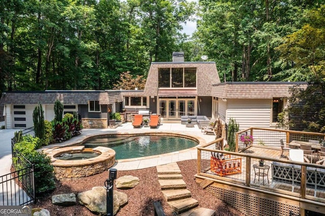4850 Lake Fjord Pass, Marietta, GA 30068 - view of pool with a deck, french doors, a pool with connected hot tub, a patio area, and outdoor dining space