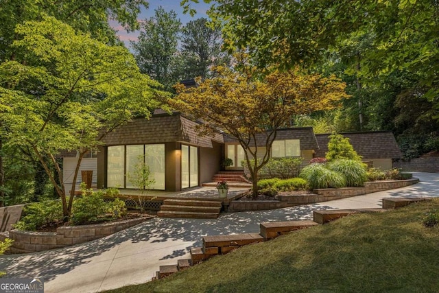 4850 Lake Fjord Pass, Marietta, GA 30068 - view of front of home featuring mansard roof and roof with shingles