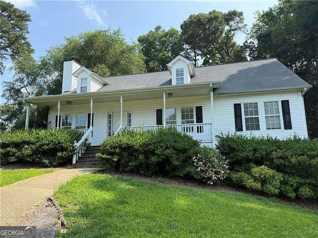 296 Hayes Trce, Hiram, GA 30141 - view of front of property featuring a porch, a front yard, and a chimney