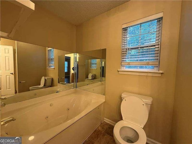296 Hayes Trce, Hiram, GA 30141 - full bathroom with a jetted tub and a textured ceiling