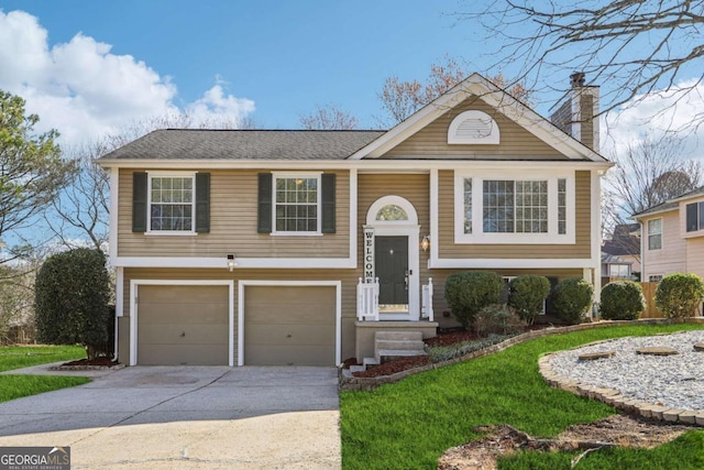 10475 Willow Meadow Cir, Alpharetta, GA 30022 - raised ranch with a garage, concrete driveway, a chimney, and a front yard