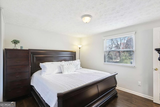 10475 Willow Meadow Cir, Alpharetta, GA 30022 - bedroom with dark wood-style flooring and a textured ceiling