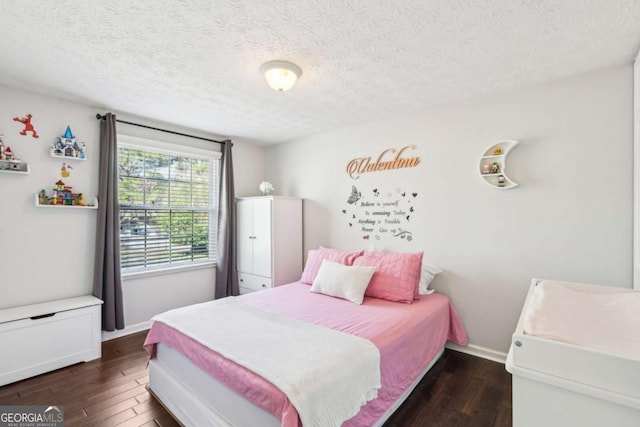 10475 Willow Meadow Cir, Alpharetta, GA 30022 - bedroom featuring dark wood-style flooring and a textured ceiling