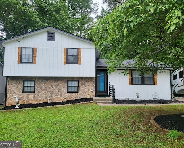 6118 Dana Ct Unit 6, Lithonia, GA 30058 - tri-level home featuring stone siding, a front yard, and board and batten siding
