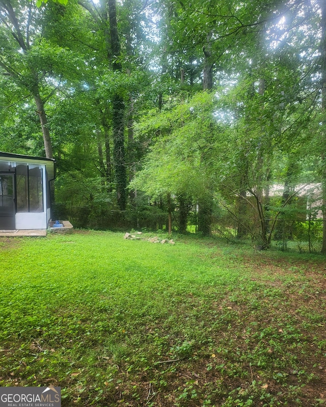 6118 Dana Ct Unit 6, Lithonia, GA 30058 - view of green lawn with a sunroom