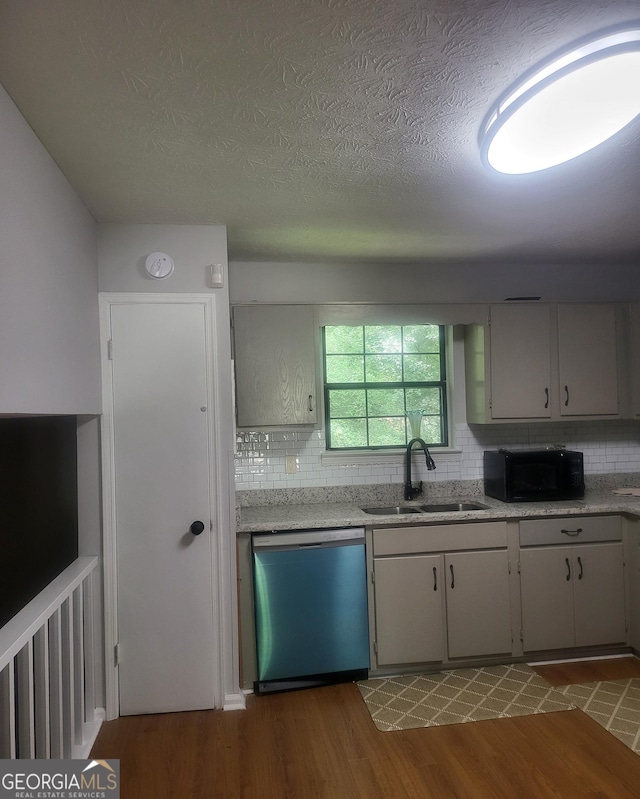 6118 Dana Ct Unit 6, Lithonia, GA 30058 - kitchen featuring dishwasher, black microwave, tasteful backsplash, wood finished floors, and a textured ceiling