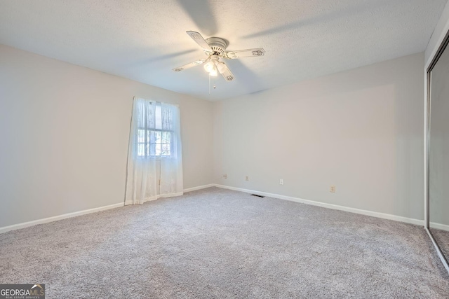 6118 Dana Ct Unit 6, Lithonia, GA 30058 - unfurnished room featuring carpet, ceiling fan, and a textured ceiling