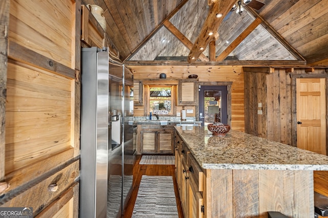 307 Big Timber Rd, Mineral Bluff, GA 30559 - kitchen with wooden ceiling, lofted ceiling, wood walls, a center island, and light stone counters