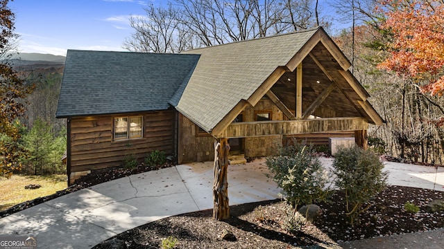 307 Big Timber Rd, Mineral Bluff, GA 30559 - view of front facade featuring a shingled roof and a patio