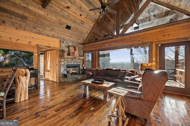 307 Big Timber Rd, Mineral Bluff, GA 30559 - living area featuring plenty of natural light, hardwood / wood-style floors, wooden walls, high vaulted ceiling, and a stone fireplace