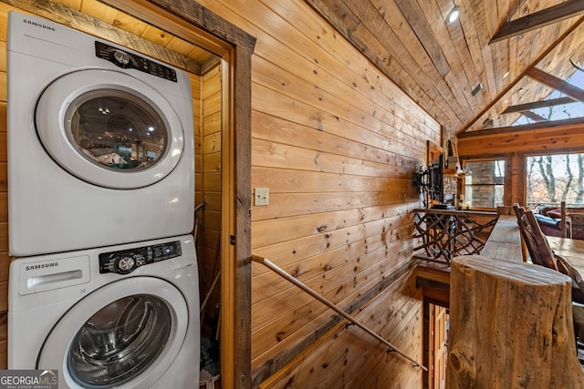 307 Big Timber Rd, Mineral Bluff, GA 30559 - laundry room featuring stacked washing machine and dryer, wooden walls, and wood ceiling