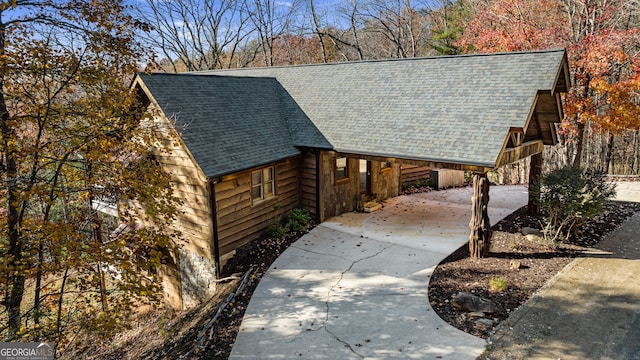 307 Big Timber Rd, Mineral Bluff, GA 30559 - view of front of home featuring roof with shingles, concrete driveway, and a carport