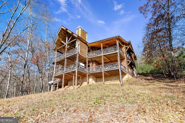 307 Big Timber Rd, Mineral Bluff, GA 30559 - rear view of house featuring a chimney, a wooden deck, and ceiling fan