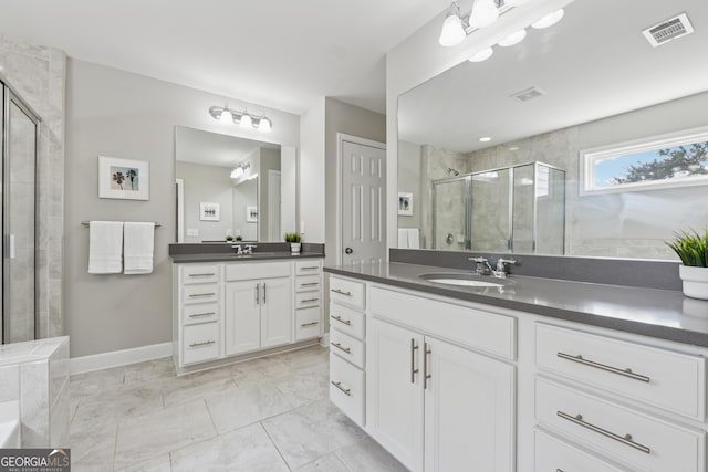 733 Wexford Cove Way, Mableton, GA 30126 - full bathroom featuring a stall shower, two vanities, and marble finish flooring