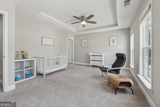 733 Wexford Cove Way, Mableton, GA 30126 - carpeted bedroom featuring a tray ceiling, ornamental molding, and a ceiling fan
