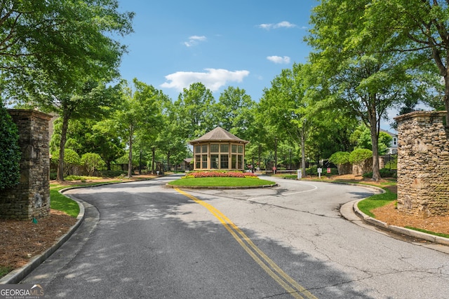 733 Wexford Cove Way, Mableton, GA 30126 - view of asphalt road with curbs and view of scattered trees