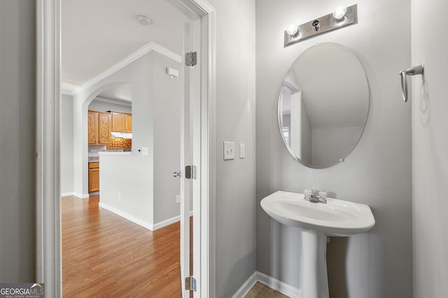 7177 Fringe Flower Dr, Austell, GA 30168 - bathroom with crown molding and wood finished floors