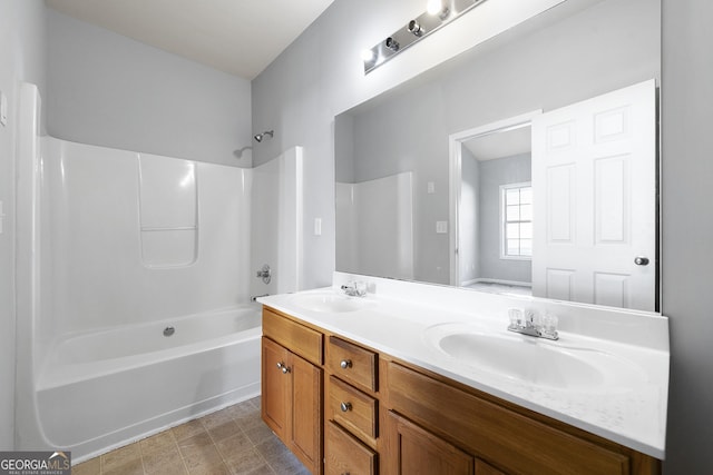 7177 Fringe Flower Dr, Austell, GA 30168 - bathroom featuring double vanity and shower / bathtub combination