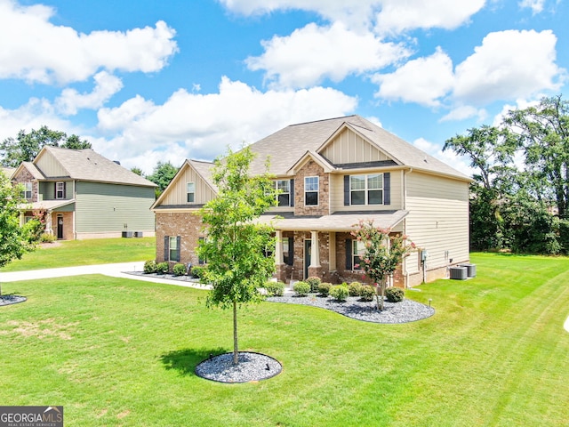 117 Elkins Blvd, Locust Grove, GA 30248 - craftsman house with brick siding, a front yard, board and batten siding, and a porch
