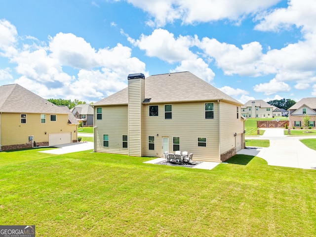 117 Elkins Blvd, Locust Grove, GA 30248 - back of property featuring a residential view, a patio, a yard, and driveway